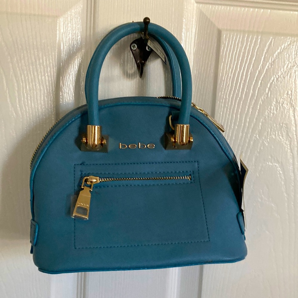 Bebe NWT small handbag. Strap for crossbody use missing